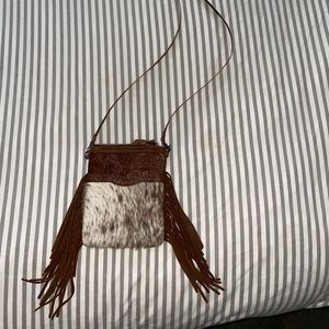 Small genuine leather & cow hide cross body purse with fringe